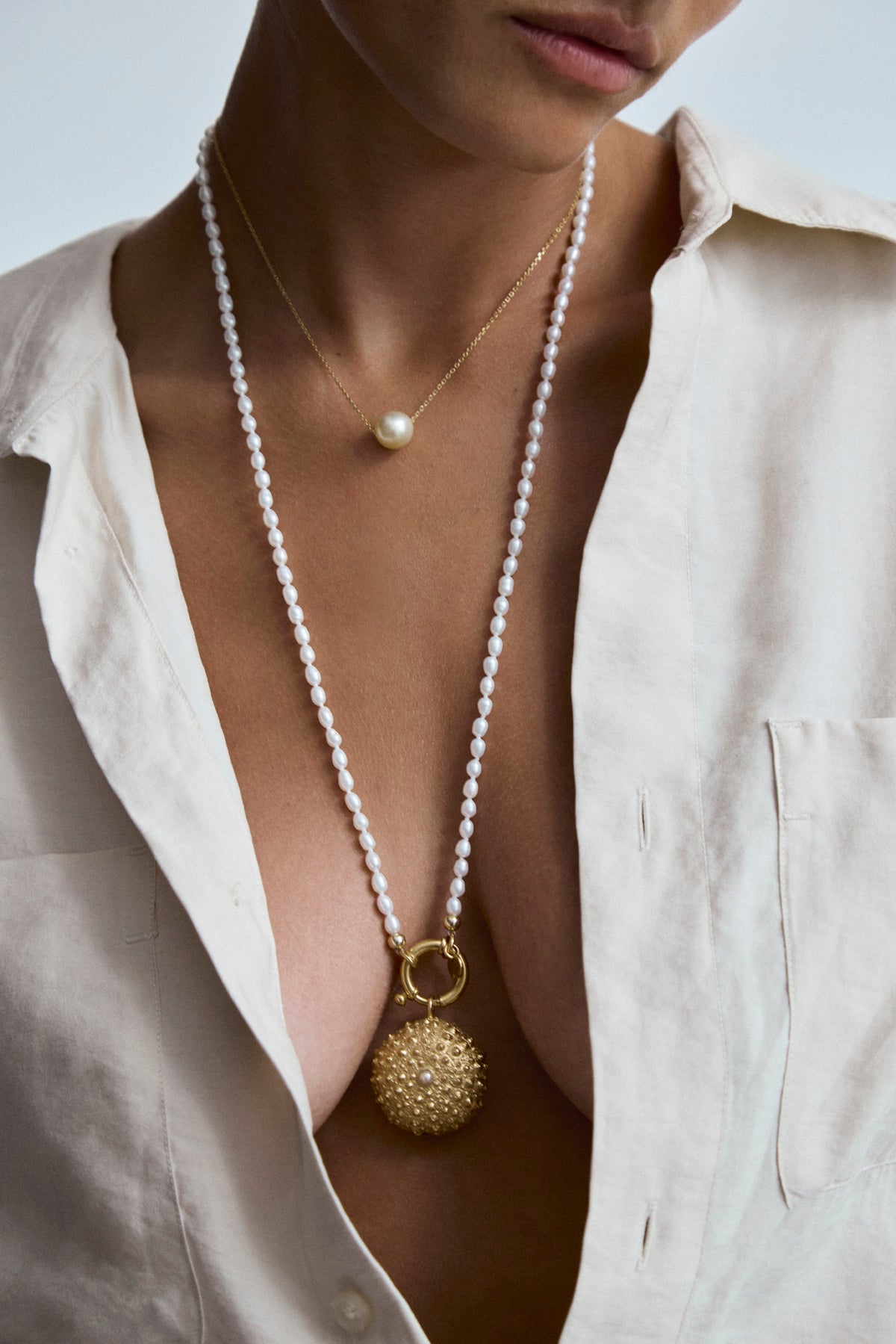 Oceano Jewels Surinam 70cm gold necklace with white rice pearls and sea urchin pendant