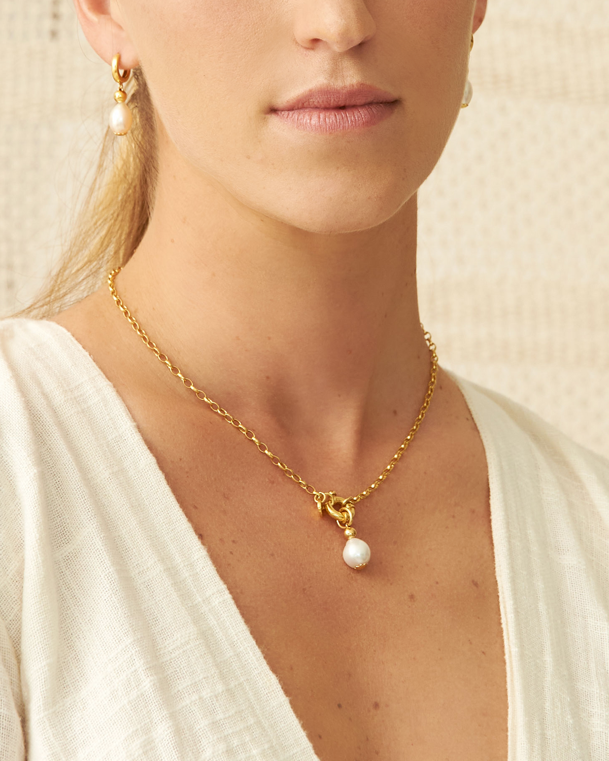 Close-up of Bois Chéri 10 mm round freshwater pearl and 18K gold vermeil necklace