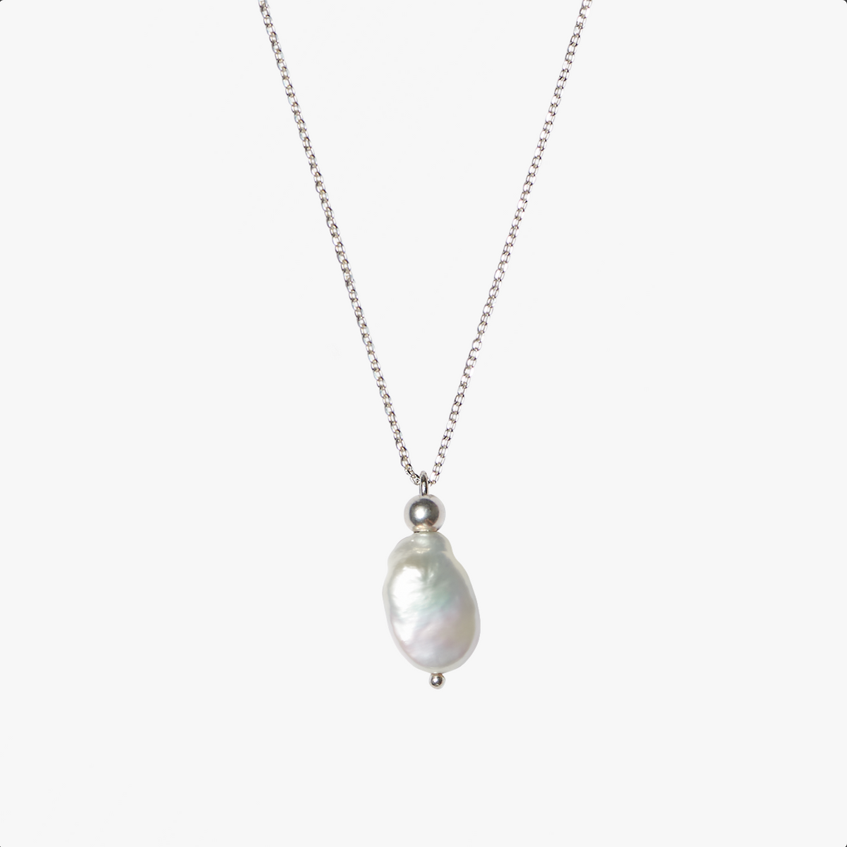 Ile D'Ambre silver necklace with a white freshwater flat pearl, handcrafted by Oceano Jewels in Mauritius