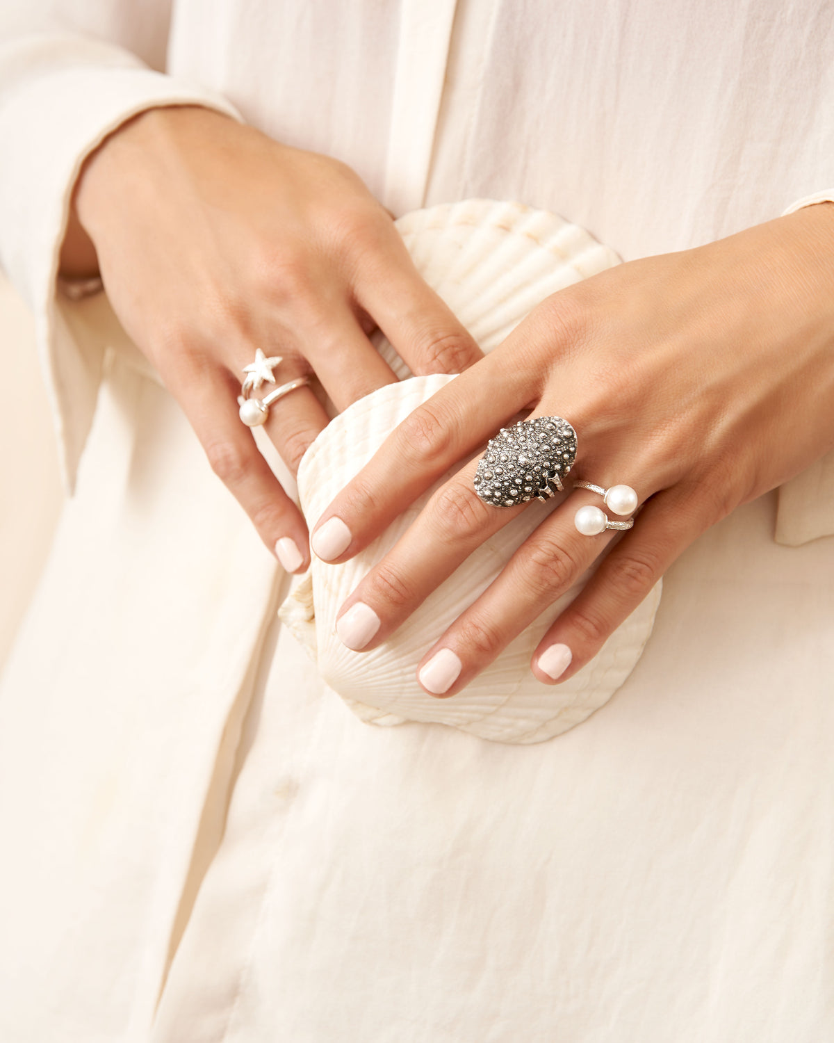 Open-ended Trou d'Eau Douce ring featuring a hand-beaten 925 sterling silver band and two white freshwater pearls