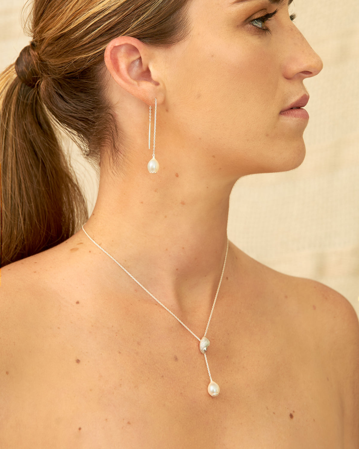 Detail of Trou d'eau Douce sterling silver shell necklace with 9mm white freshwater pearl