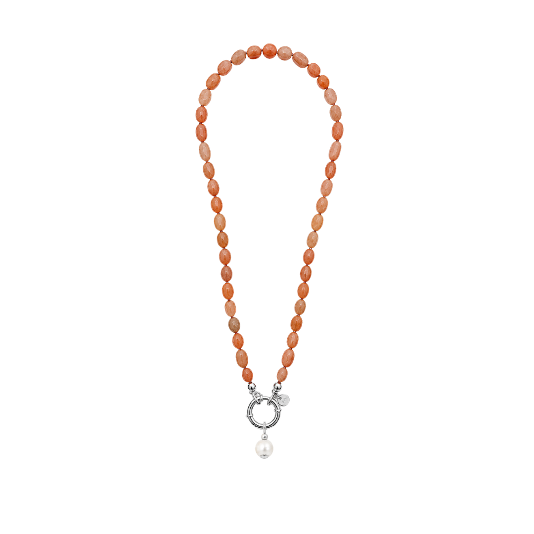A beaded necklace made of peach-orange marbled beads, featuring a silver-tone ring clasp and a dangling white pearl, shown on a plain white background.