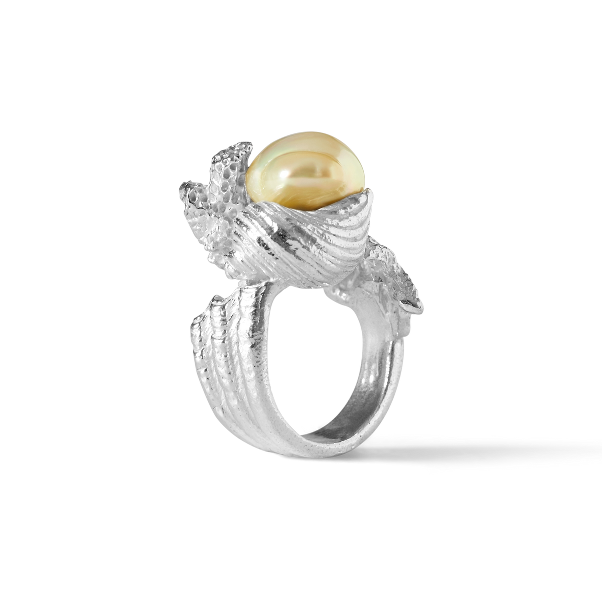 Close-up detail of an 11mm Golden South Sea pearl in a sculptural sterling silver ring