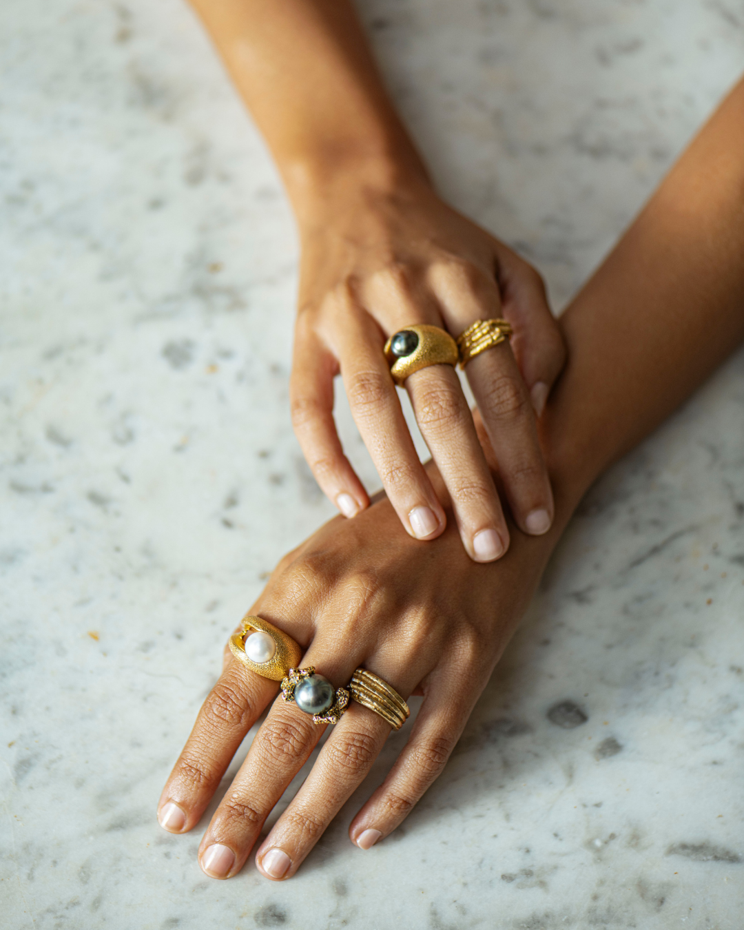 Detail of Ile aux Cerfs 18K gold ring and natural 13.5mm white South Sea pearl