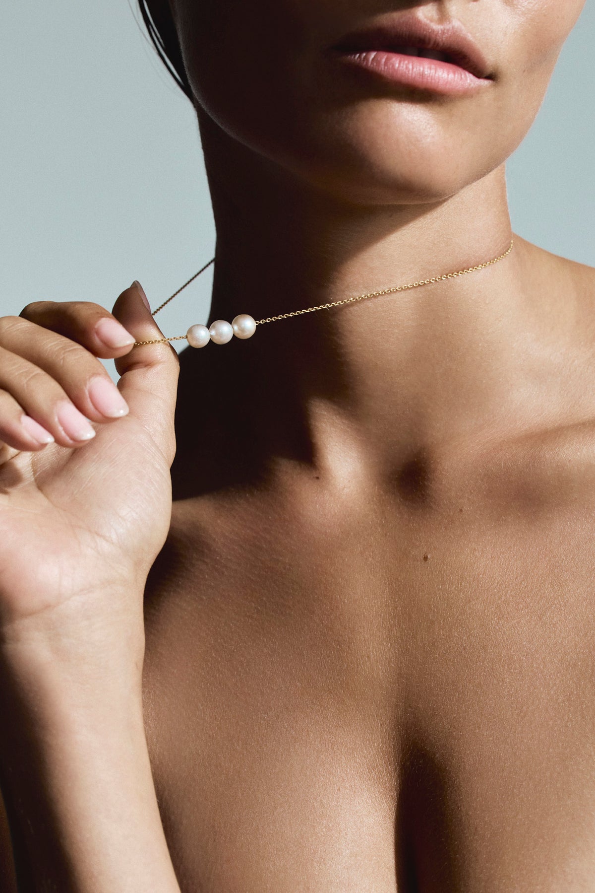 Three 8mm South Sea pearls in white, champagne and golden tones on an 18K yellow gold chain