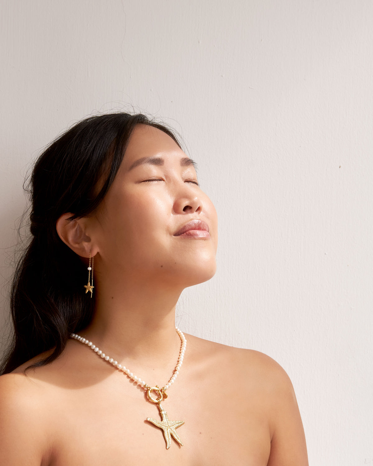 Les Salines gold starfish pearl drop earrings with 4mm freshwater pearls, handmade in Mauritius by Oceano Jewels