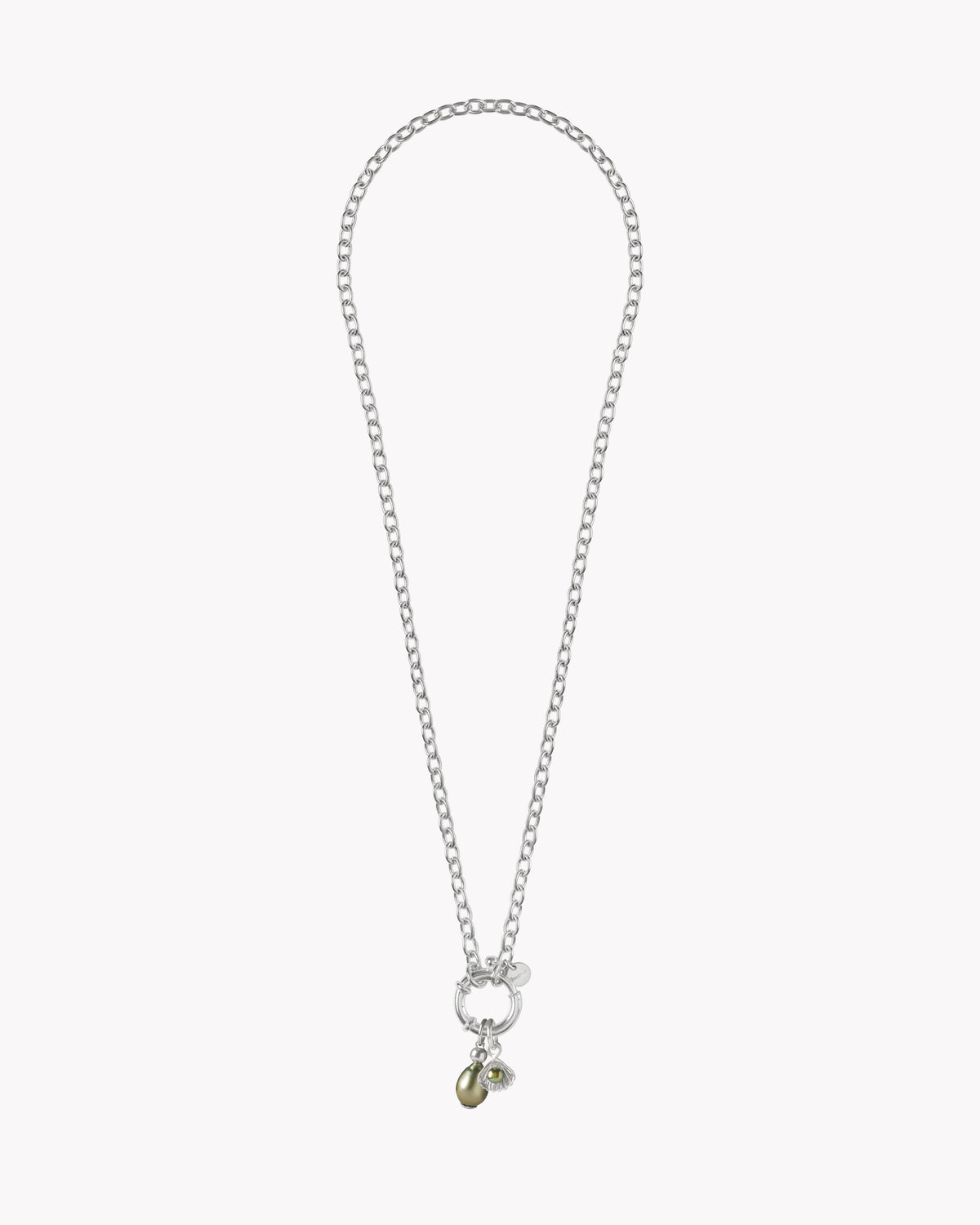 Close-up of alphabet charm on the St Géran sterling silver necklace