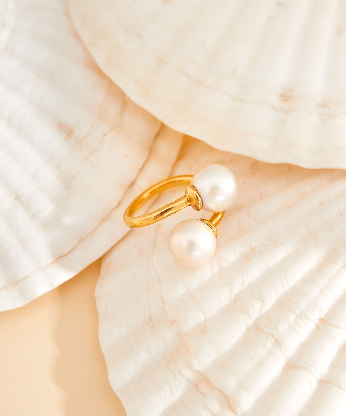 Close-up detail of the Trou D'Eau Douce gold vermeil ring with lustrous white freshwater pearls